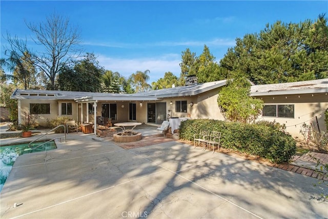 rear view of property with a patio