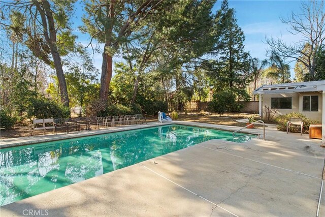 view of swimming pool featuring a patio