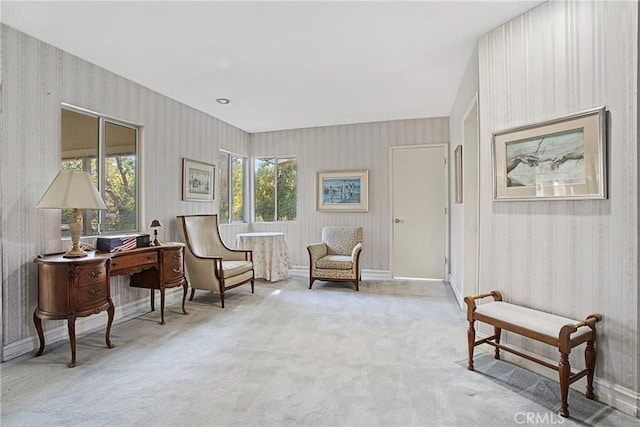 sitting room featuring light carpet