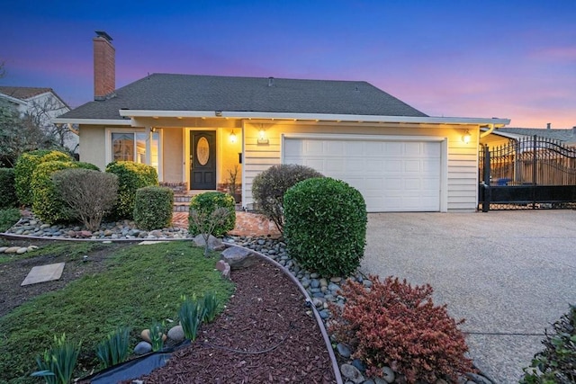 view of front of property featuring a garage