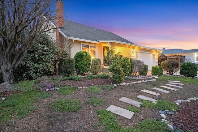 view of front of home featuring a garage