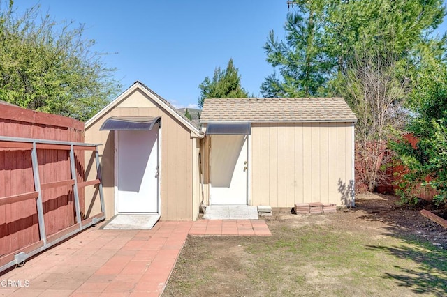 view of shed with fence