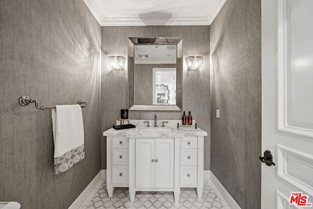 bathroom with crown molding and vanity