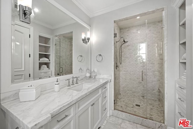 bathroom featuring built in shelves, ornamental molding, a shower with shower door, and vanity