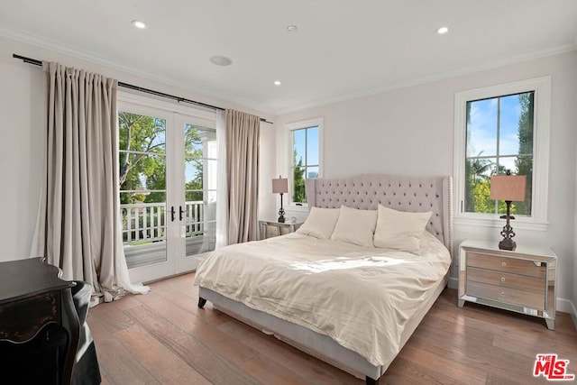 bedroom featuring crown molding, access to exterior, french doors, and light wood-type flooring