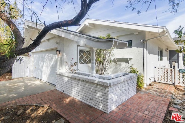 view of property exterior featuring a garage