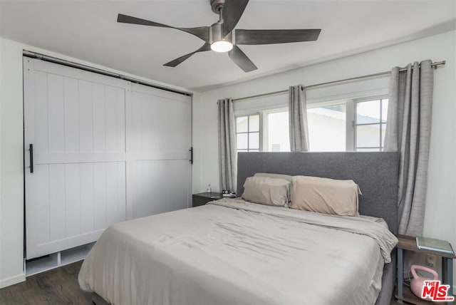 bedroom with ceiling fan and dark hardwood / wood-style flooring