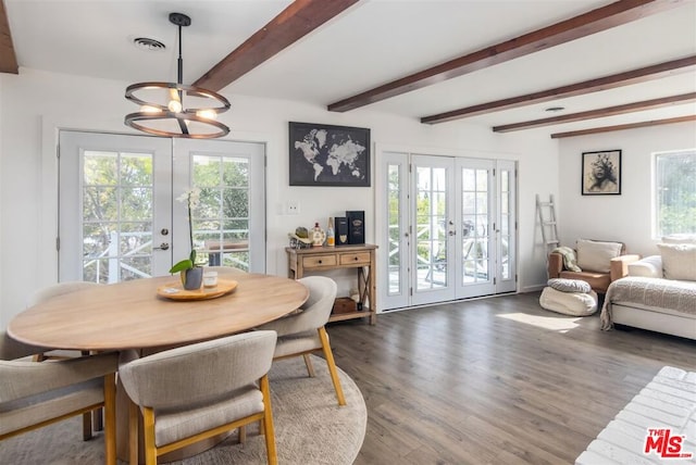 dining room with beam ceiling, hardwood / wood-style flooring, french doors, and a healthy amount of sunlight