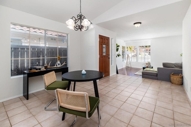 interior space with vaulted ceiling and a notable chandelier