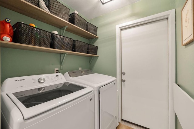 washroom with washing machine and dryer