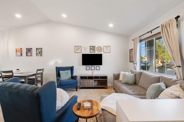 living room featuring vaulted ceiling