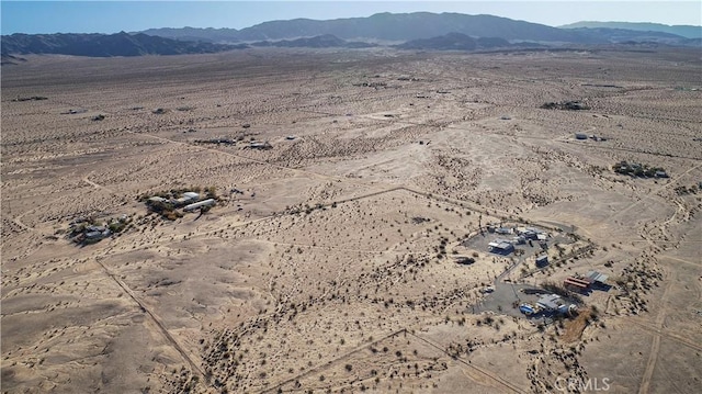 birds eye view of property featuring a mountain view