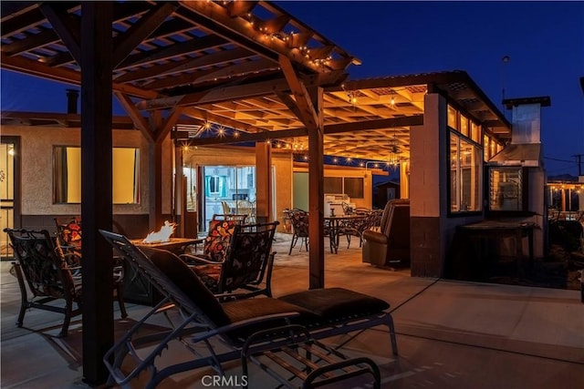 view of patio with a pergola and an outdoor fire pit