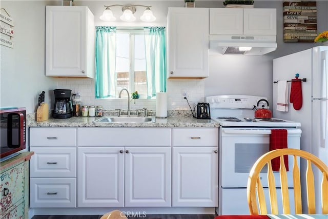 kitchen with tasteful backsplash, white cabinetry, sink, and white appliances