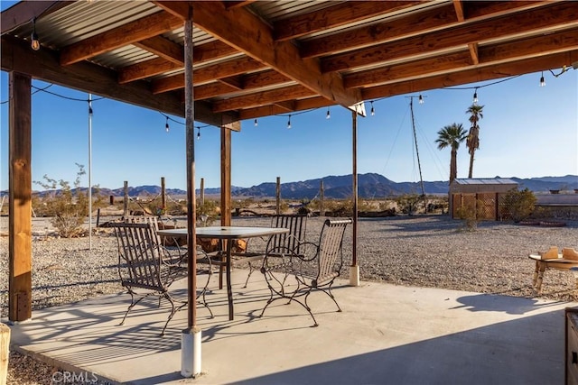 view of patio / terrace with a mountain view