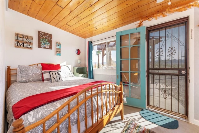 bedroom featuring vaulted ceiling and wooden ceiling