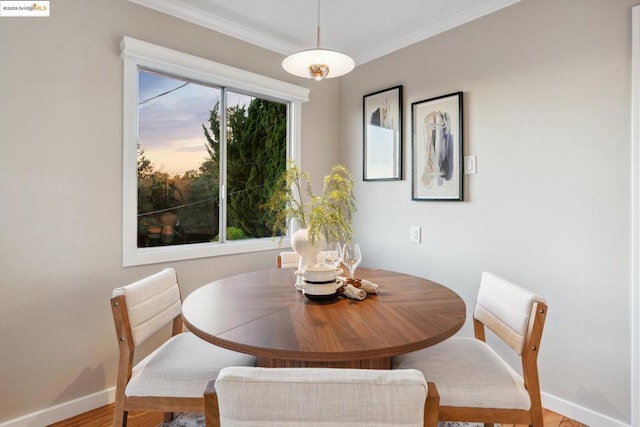 dining room featuring crown molding