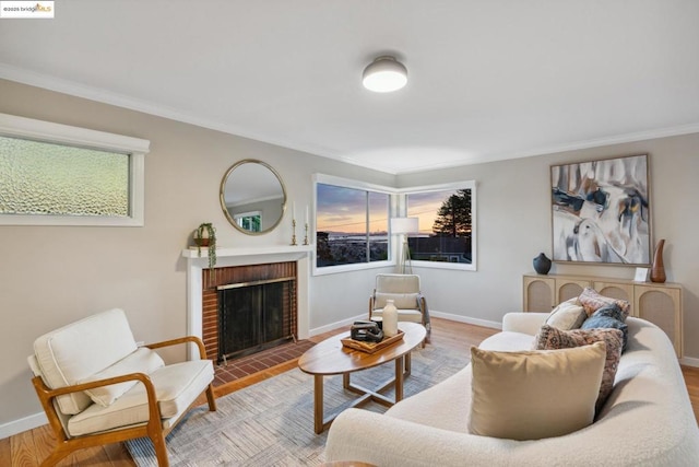 living room with hardwood / wood-style floors, a brick fireplace, and a wealth of natural light