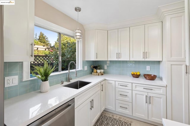 kitchen featuring sink, tasteful backsplash, decorative light fixtures, dishwasher, and white cabinets