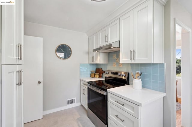 kitchen featuring tasteful backsplash, white cabinetry, and stainless steel range with electric stovetop