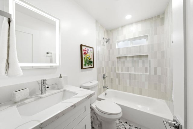 full bathroom with vanity, toilet, and tiled shower / bath combo