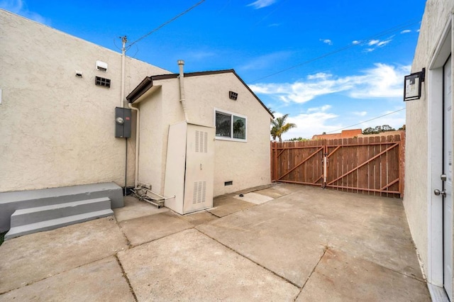 view of side of property with a patio