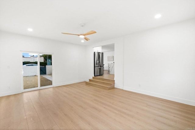 unfurnished room with light hardwood / wood-style flooring and ceiling fan