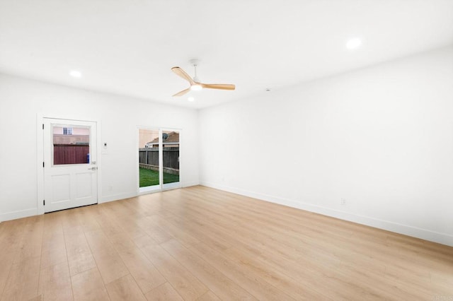 unfurnished room with ceiling fan and light hardwood / wood-style flooring