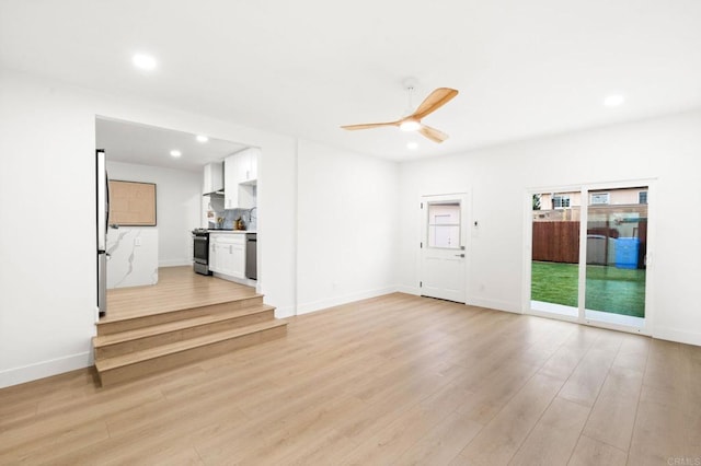 unfurnished living room with light hardwood / wood-style floors and ceiling fan