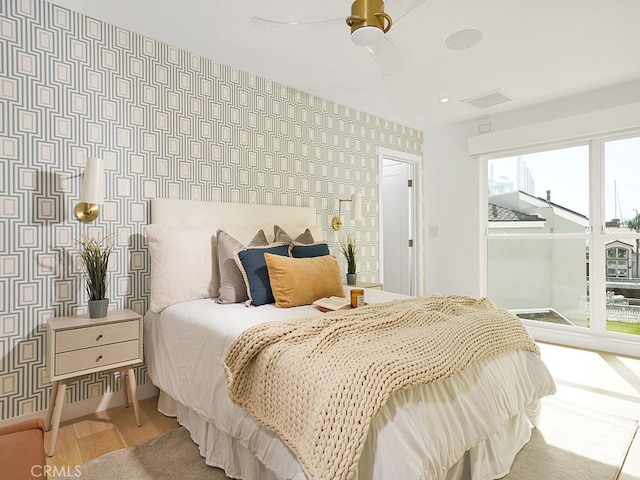 bedroom featuring hardwood / wood-style floors and ceiling fan