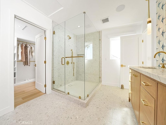 bathroom with vanity and walk in shower