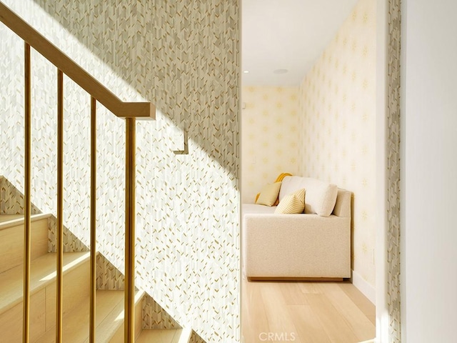 stairway with hardwood / wood-style floors