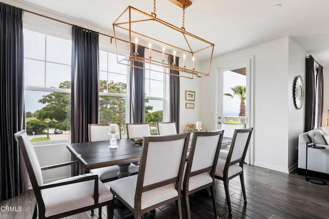 dining space with dark wood-type flooring and a healthy amount of sunlight