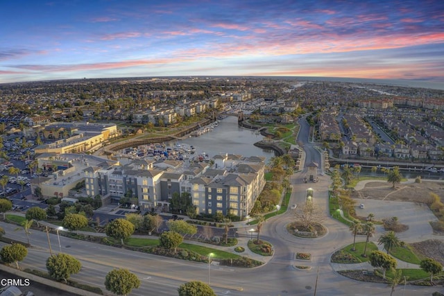 aerial view at dusk with a water view