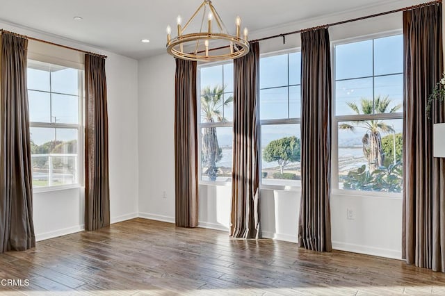 interior space featuring hardwood / wood-style floors and a chandelier