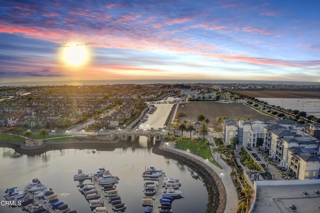 aerial view at dusk with a water view