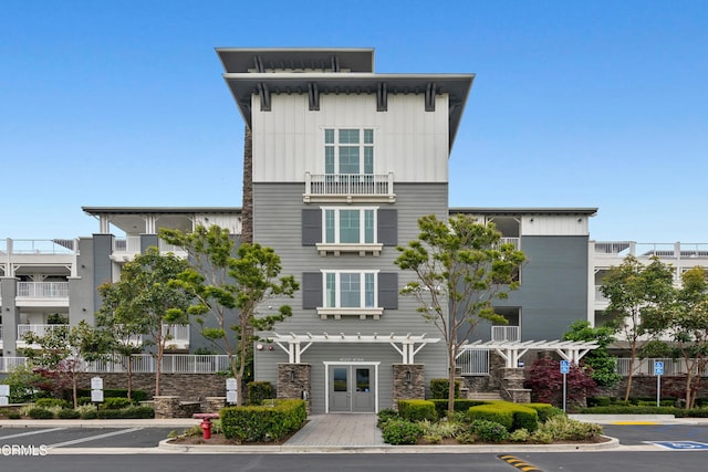 view of property featuring uncovered parking