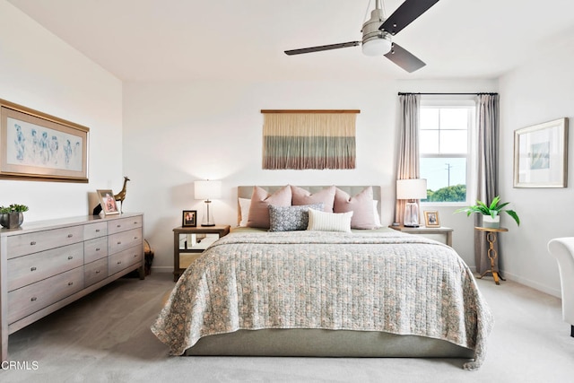 carpeted bedroom featuring baseboards