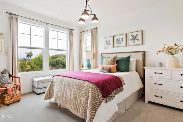 bedroom featuring light colored carpet