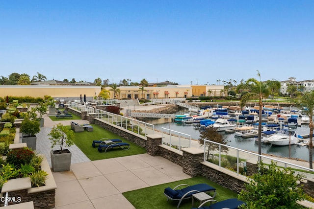 exterior space featuring a boat dock and a water view