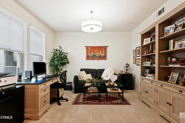 office area with light colored carpet and visible vents