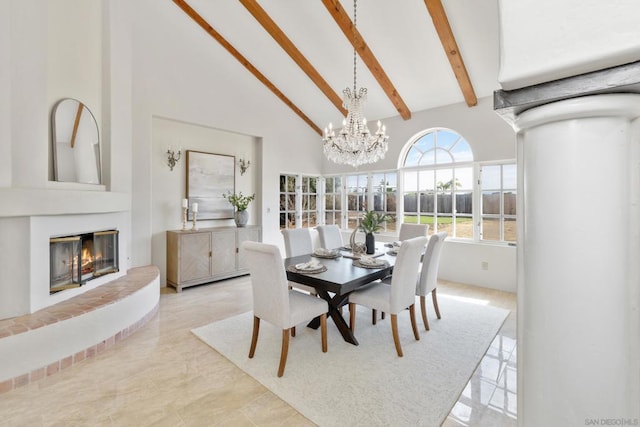 dining room featuring beam ceiling, high vaulted ceiling, and a chandelier