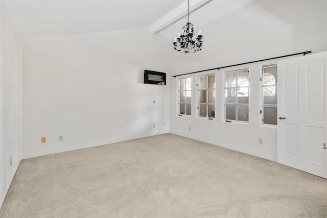 carpeted spare room featuring beamed ceiling, a notable chandelier, high vaulted ceiling, and a wealth of natural light