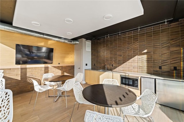 interior space with sink and light wood-type flooring