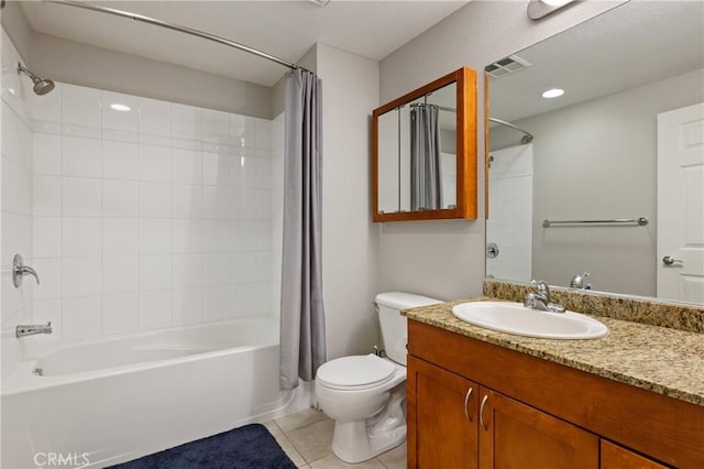 full bathroom featuring vanity, shower / tub combo with curtain, tile patterned floors, and toilet