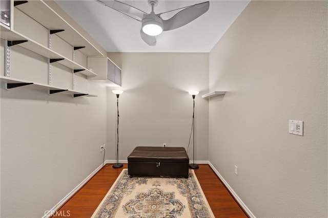 interior space with dark wood-type flooring and ceiling fan