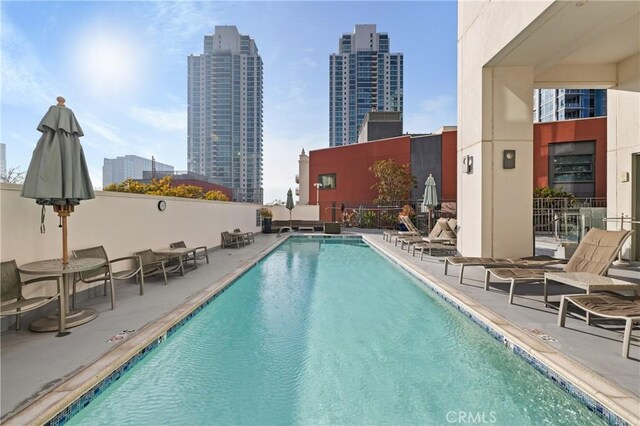 view of swimming pool featuring a patio