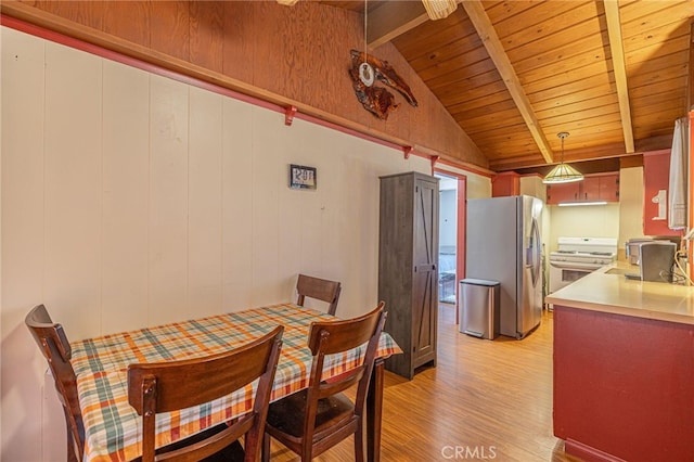 dining space featuring wooden ceiling, sink, light wood-type flooring, and vaulted ceiling with beams