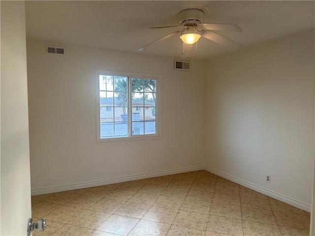 unfurnished room featuring light tile patterned floors and ceiling fan