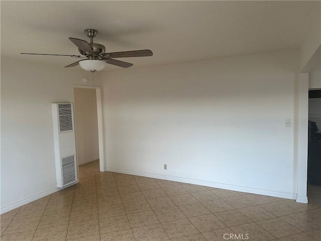 spare room with ceiling fan